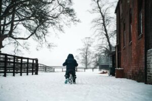 kid on bike in the snow