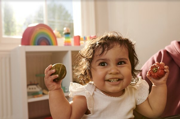 child holding dried fruit