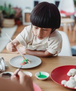 child colour painting salt dough