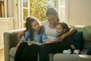 nanny with children reading