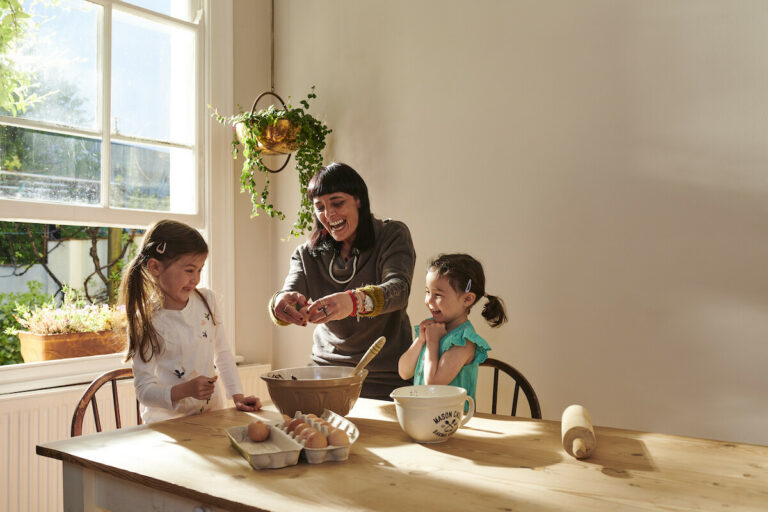 nanny and children having fun and baking together