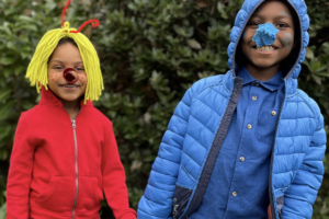Two school children dressed as book characters The Smeds and The Smoos by Julia Donaldson