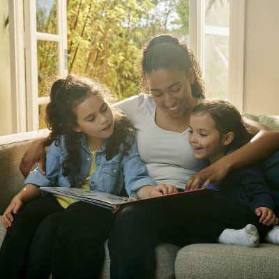 nanny with children reading