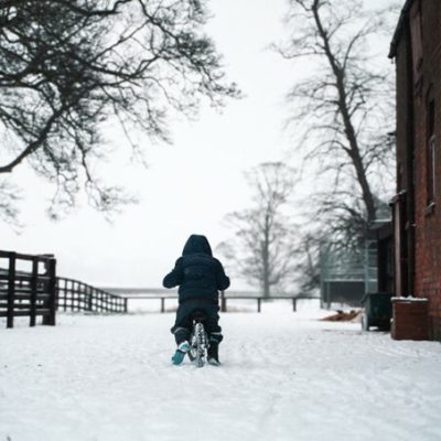 kid on bike in the snow